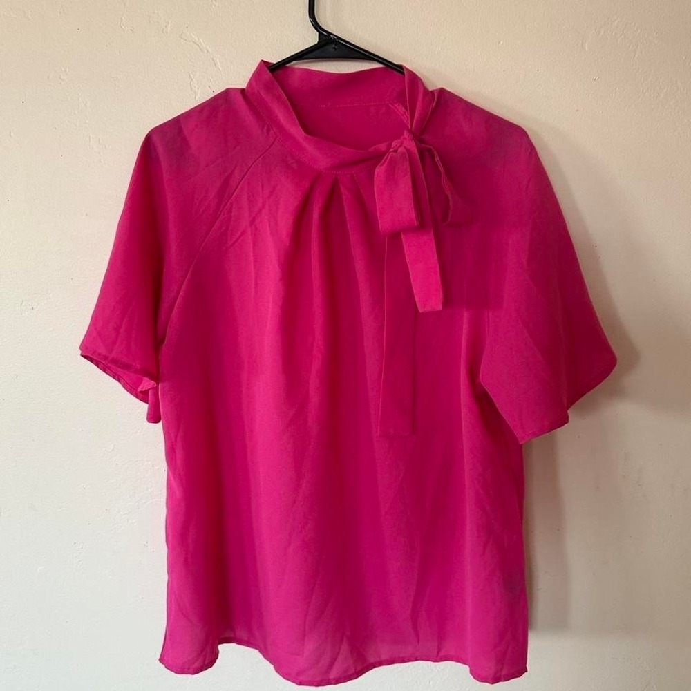 Pink blouse with bow detail